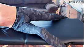 Stretching in compression pants on massage table