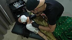 indian tattoo girl orgasms hard in pussy during ink session