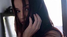 petite euro teen elilith noir strips out of see-through clothes posing her small tits and ass seductively