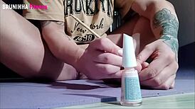 Sexy Brazilian paints toenails flashing shaved pussy clit toes close-up to tease