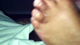 ebony babe strokes black cock with her sexy feet