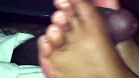 ebony babe strokes black cock with her sexy feet