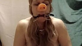 slave's self session indoctrination with pig snout blowjob and spreader