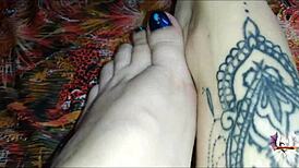 i oil up my tattooed feet and stroke your cock with perfect footjob grips