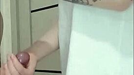 Stepmom's friend grips and strokes cock at house party