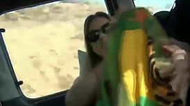 Young Blonde Teases with Toys in Car