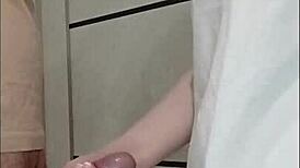 Stepmom's friend grips and strokes cock at house party