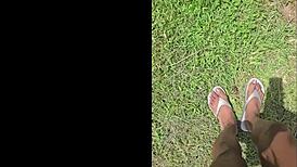 imagine giant black feet stomping tiny things in garden yard tall outdoor fetish view from below 18+