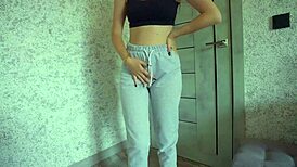 desperate student pisses sweatpants then rubs big clit pussy lips