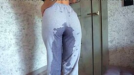 desperate student pisses sweatpants then rubs big clit pussy lips