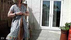 naughty housewife strips naked outdoors in lush garden surrounded by nature's wild beauty