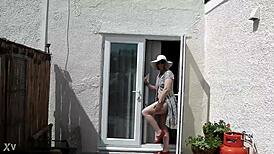 naughty housewife strips naked outdoors in lush garden surrounded by nature's wild beauty