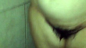 she steps in the shower soaping her big tits and ass