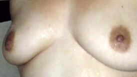 she steps in the shower soaping her big tits and ass