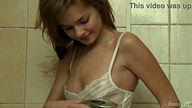 wanna watch this skinny blonde teen finger her shaved pussy in the bath?