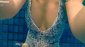 Wife flashes hot one-piece swimsuit at hotel pool