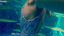 Wife flashes hot one-piece swimsuit at hotel pool