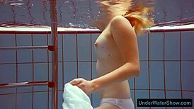 Small tits teen swims in the swimming pool